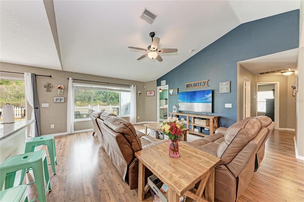 4608 Oliver Manor Drive Parrish, FL 34219 - Photo 5 of 45 a view of a dining room with furniture window and wooden floor