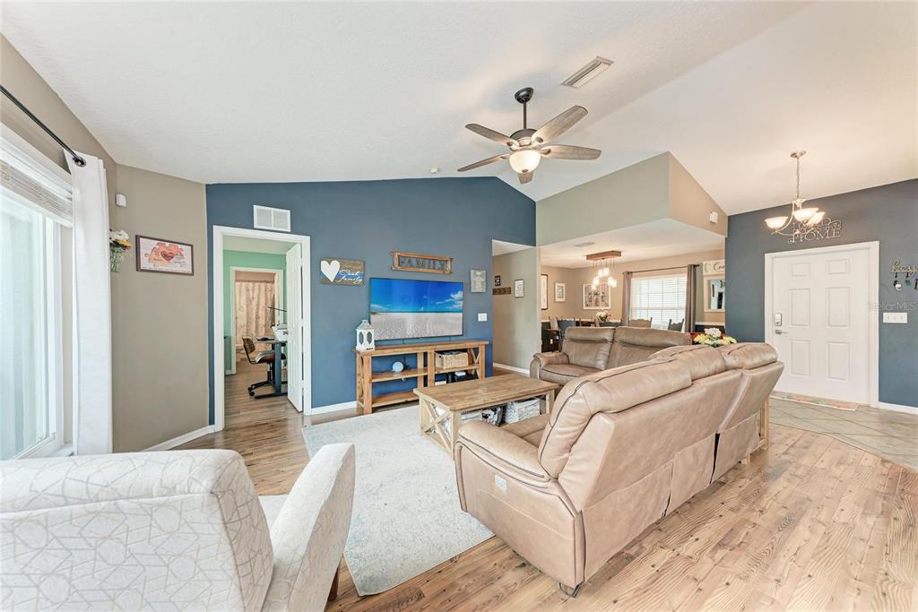 4608 Oliver Manor Drive Parrish, FL 34219 - Photo 6 of 45 a view of a livingroom with furniture and a ceiling fan