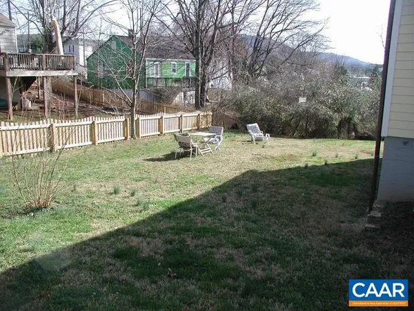 a view of a backyard with a trampoline