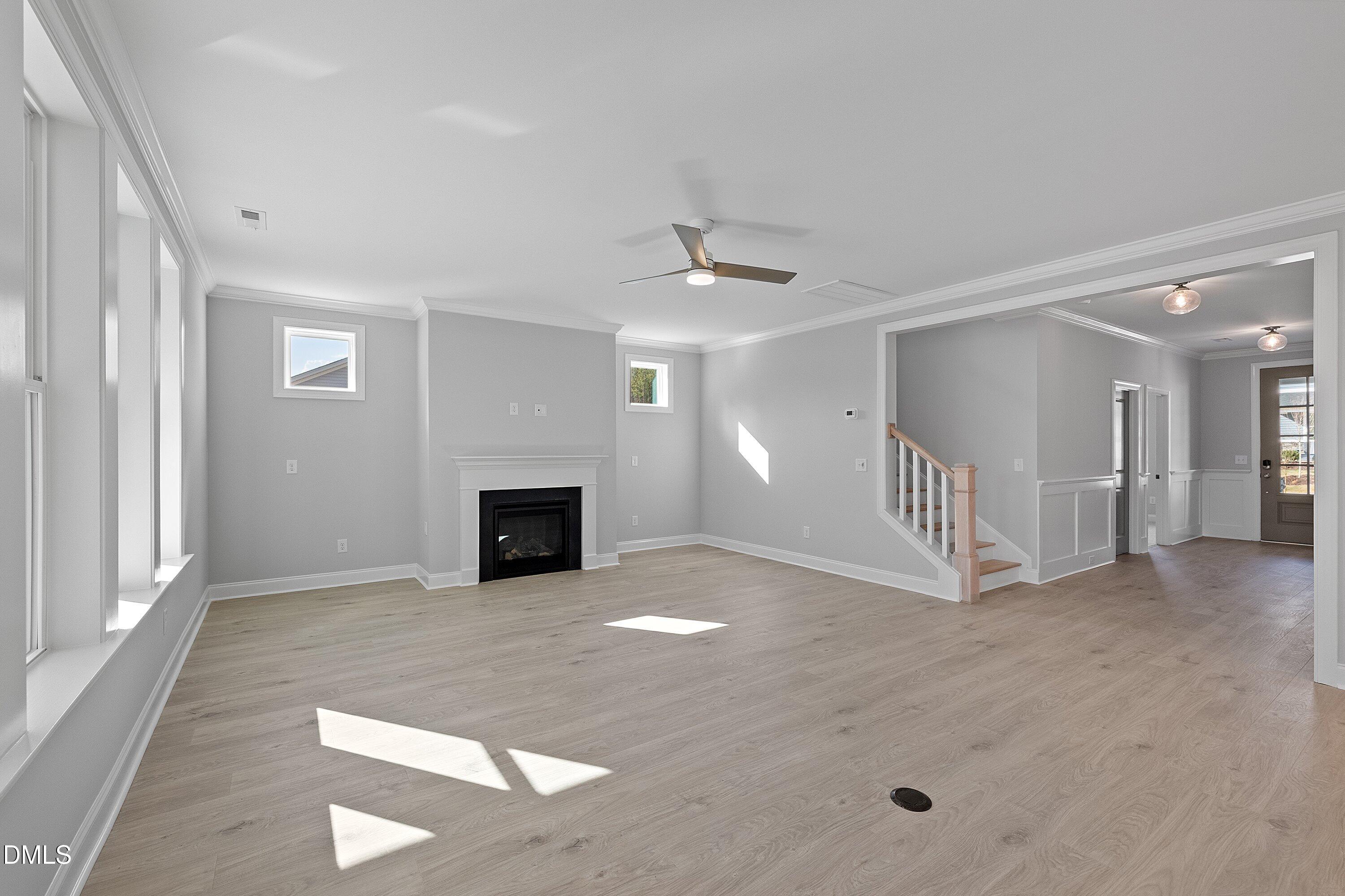 45 West Victoria Ridge Drive, Unit 32 Selma, NC 27576 - Photo 14 of 29 a view of a livingroom with a fireplace and a ceiling fan