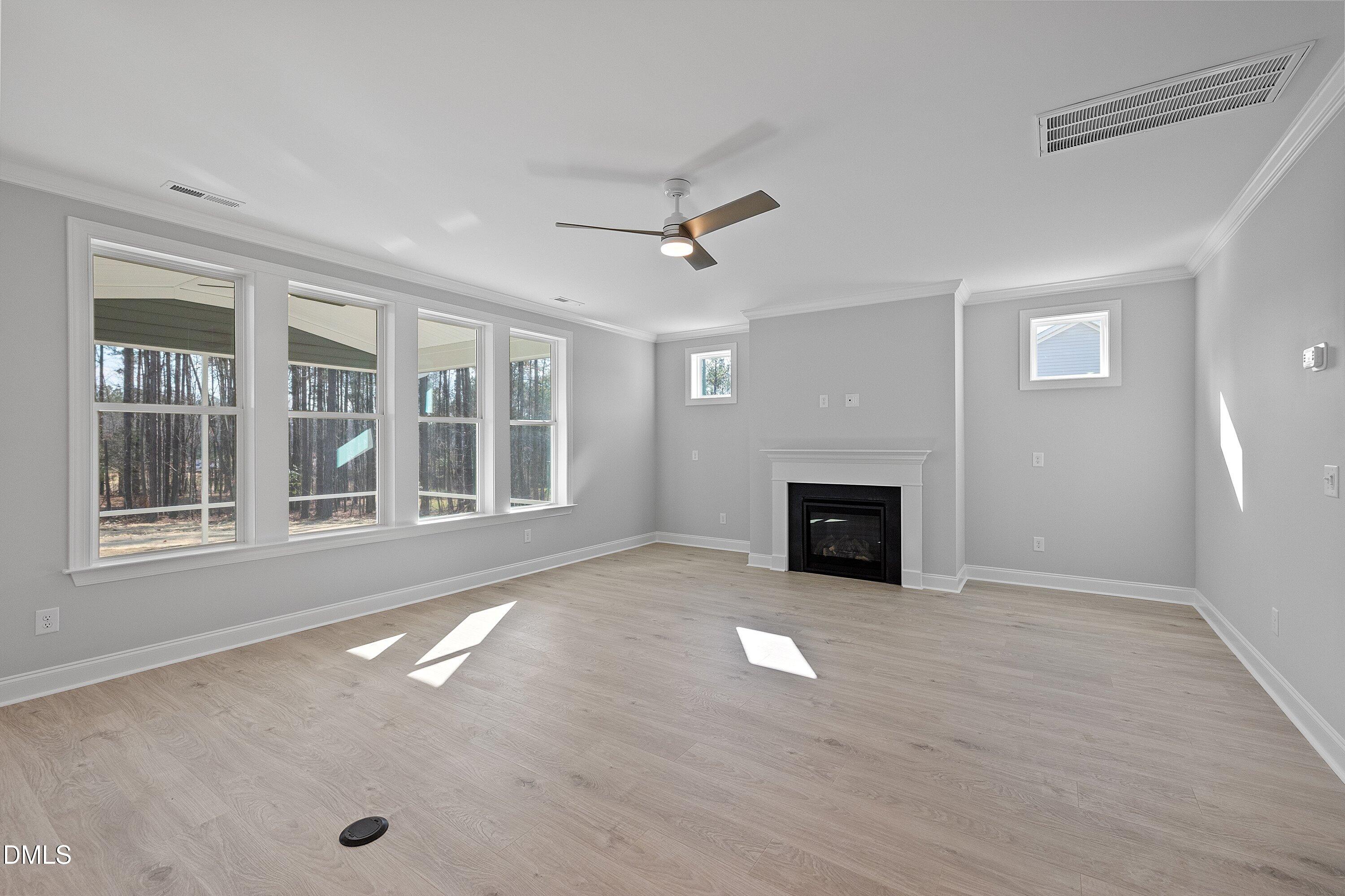 45 West Victoria Ridge Drive, Unit 32 Selma, NC 27576 - Photo 15 of 29 a view of livingroom with fireplace cabinet and windows