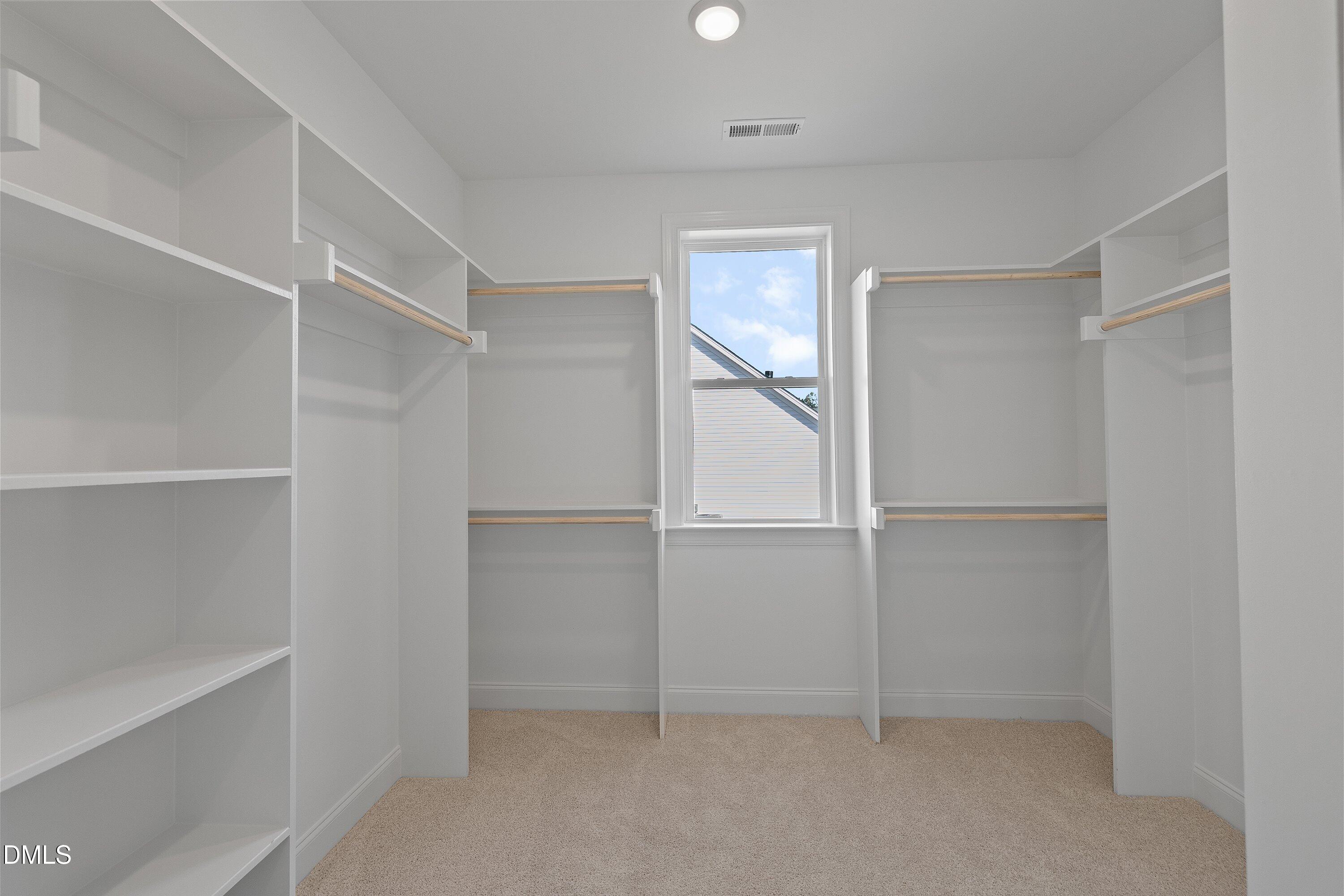 45 West Victoria Ridge Drive, Unit 32 Selma, NC 27576 - Photo 21 of 29 a view of an empty walk in closet