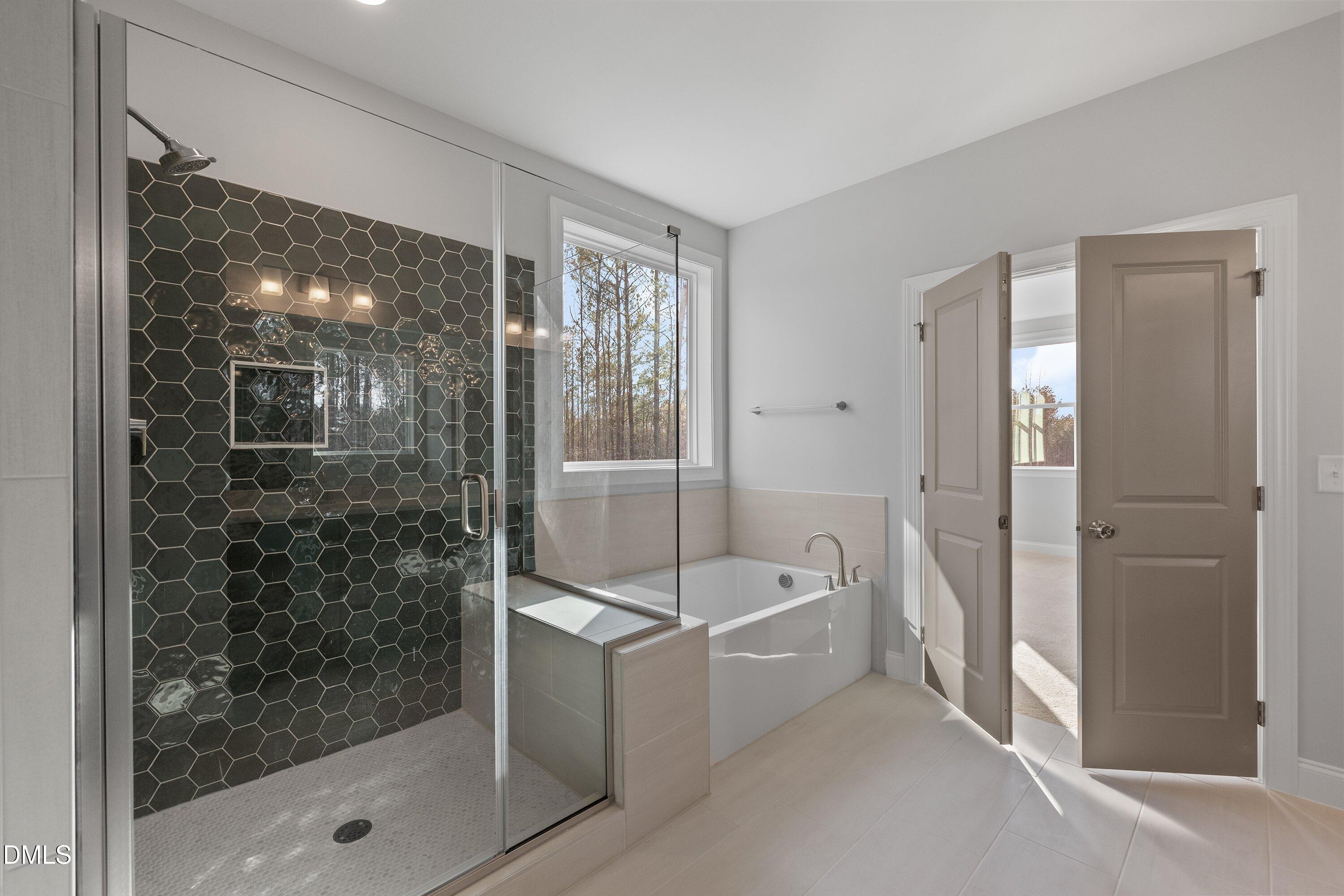 45 West Victoria Ridge Drive, Unit 32 Selma, NC 27576 - Photo 23 of 29 a bathroom with a bathtub and a shower