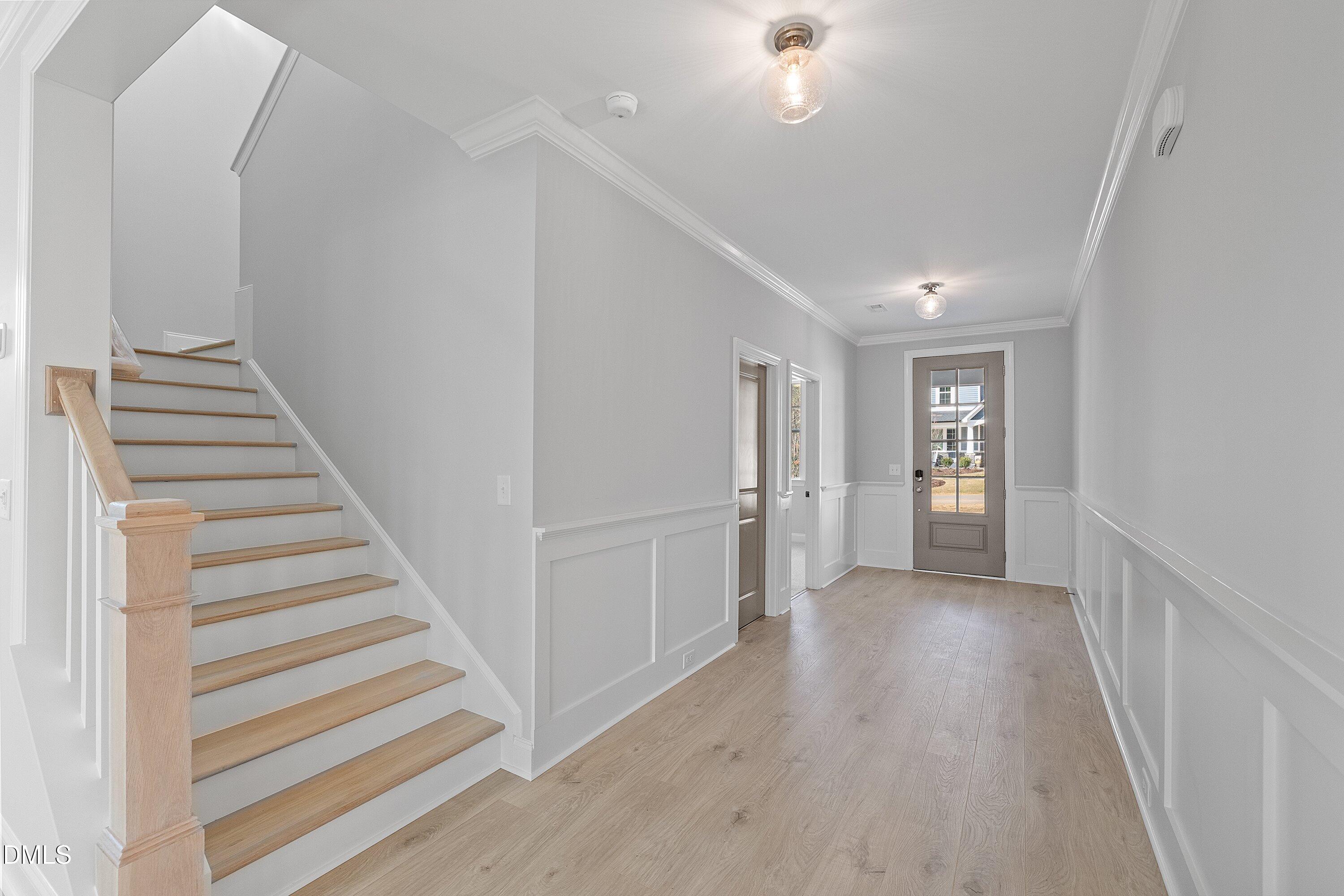 45 West Victoria Ridge Drive, Unit 32 Selma, NC 27576 - Photo 3 of 29 a view of a hallway with wooden floor and entryway