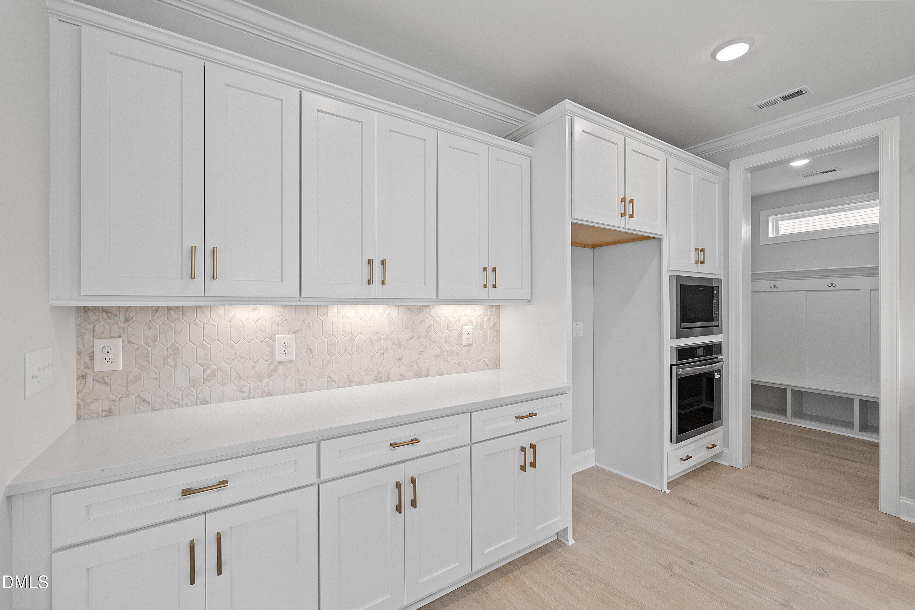 45 West Victoria Ridge Drive, Unit 32 Selma, NC 27576 - Photo 8 of 29 a kitchen with white cabinets and refrigerator