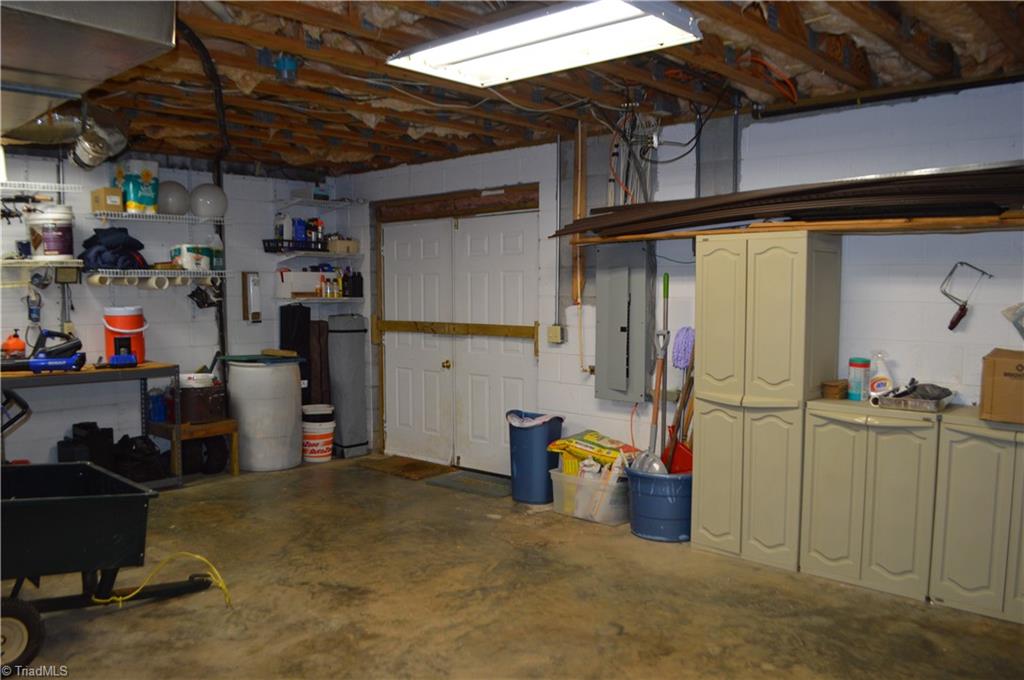551 Jackson Rd Extension Mount Airy, NC 27030 - Photo 27 of 49 Lower Level has den, large unheated room, full bath and workshop.