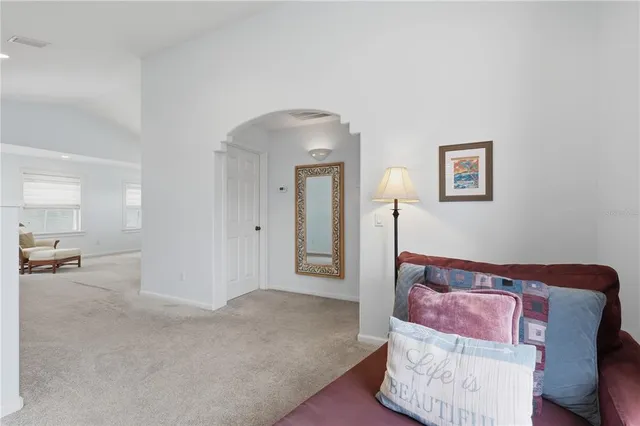 a bed room with a bed and a mirror