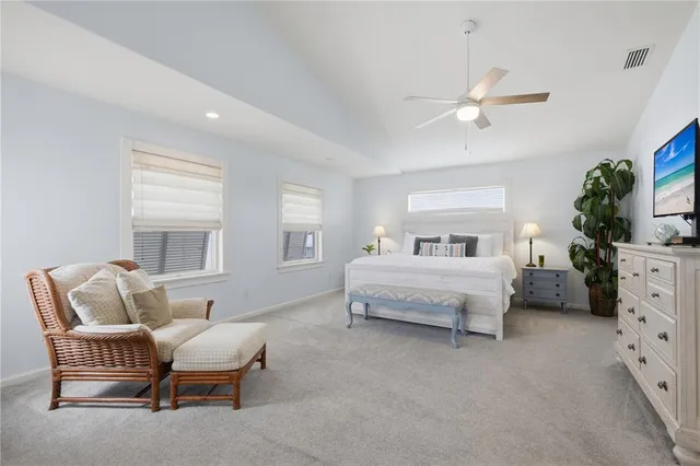 a bedroom with bed and window