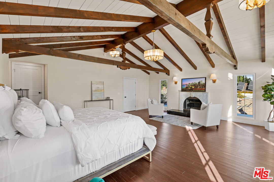 151 West Longden Avenue Arcadia, CA 91007 - Photo 19 of 46 a spacious bedroom with a bed couch and a window