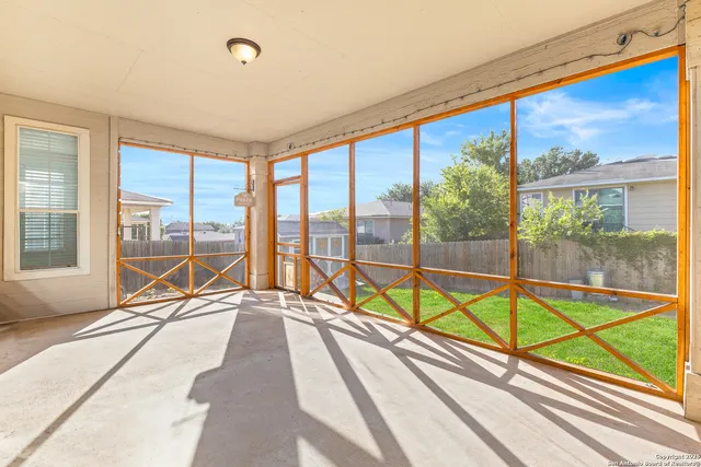 a view of a living room with a large window