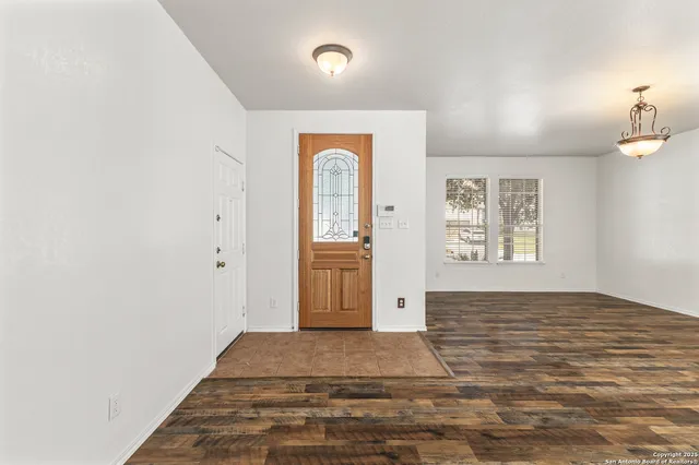 a view of an empty room and window