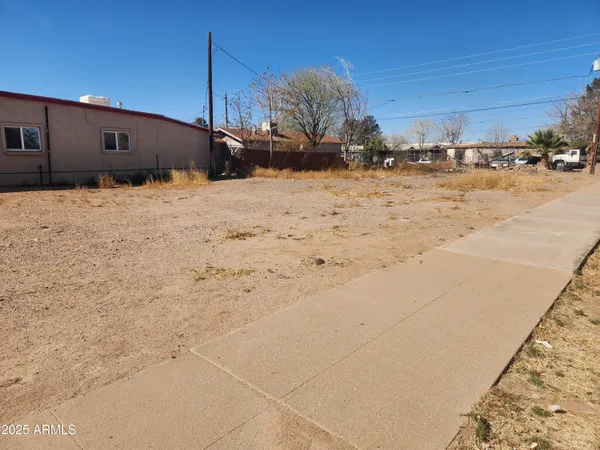 a view of street with parked cars