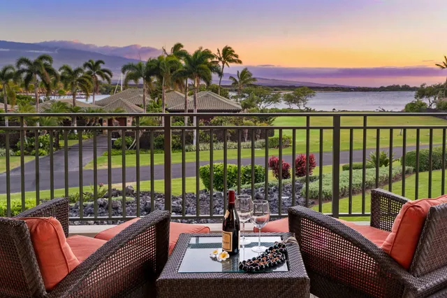 a view of a chairs and tables in the roof deck