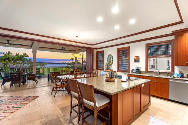 a kitchen with lots of counter top space and dining table