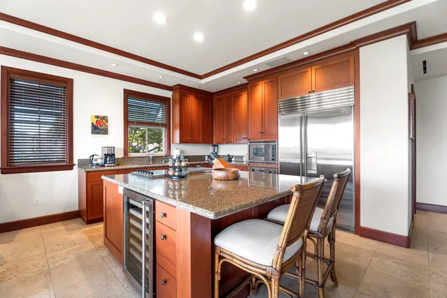 a dining table with chairs and window