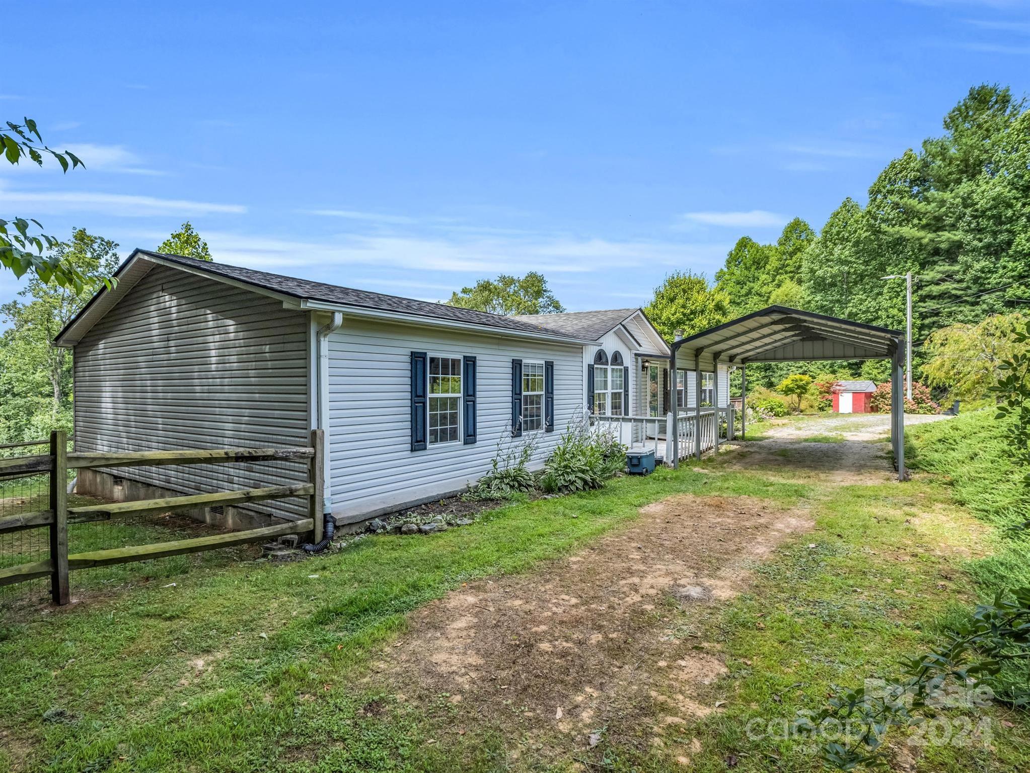 293 Bane Road Mills River, NC 28759 - Photo 1 of 48 a front view of a house with garden