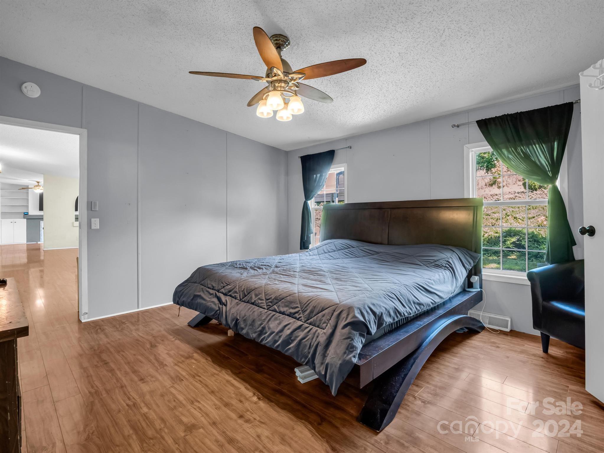 293 Bane Road Mills River, NC 28759 - Photo 18 of 48 a bedroom with a bed and window