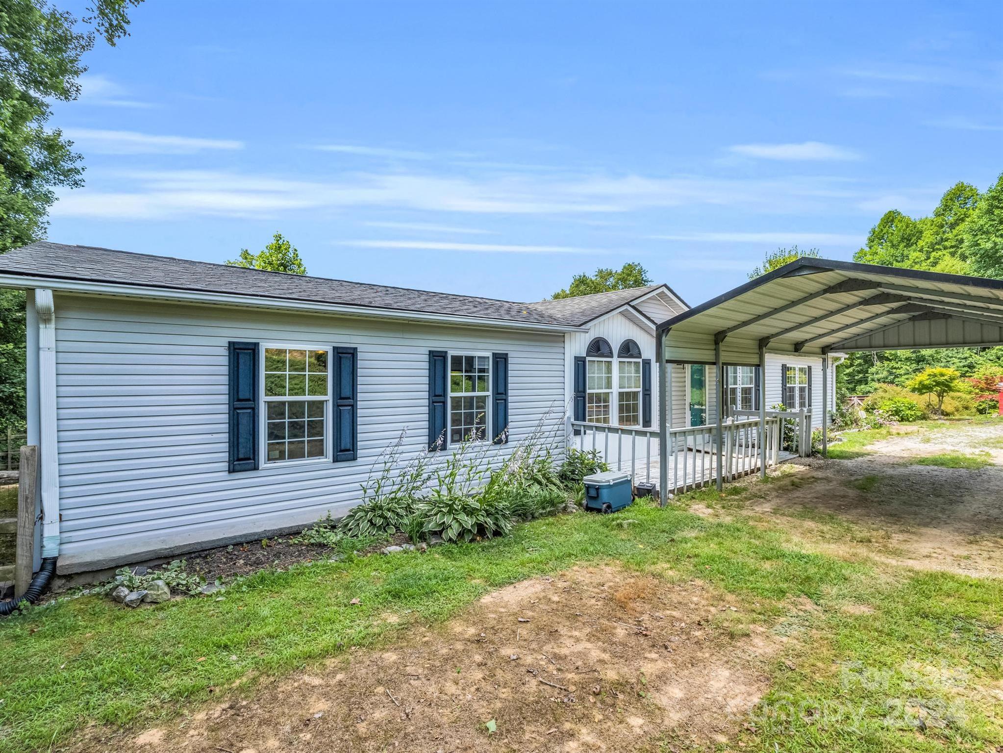 293 Bane Road Mills River, NC 28759 - Photo 2 of 48 front view of a house with a yard