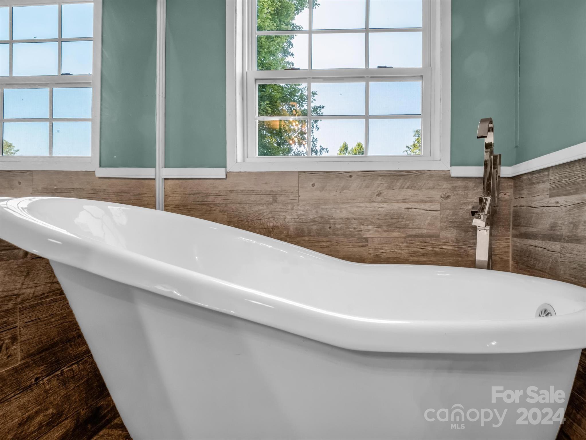 293 Bane Road Mills River, NC 28759 - Photo 21 of 48 a bath tub sitting next to a window
