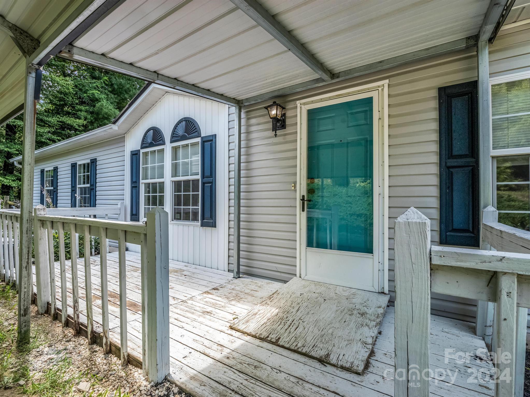 293 Bane Road Mills River, NC 28759 - Photo 4 of 48 a view of a house with a balcony