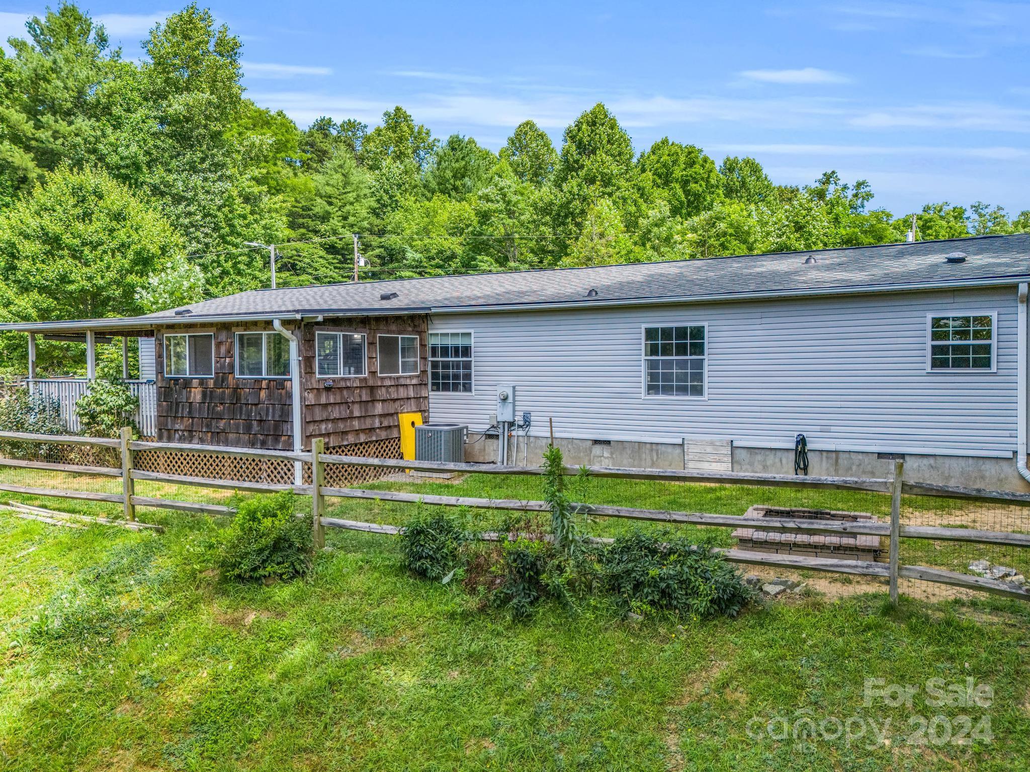293 Bane Road Mills River, NC 28759 - Photo 41 of 48 a view of a house with a backyard
