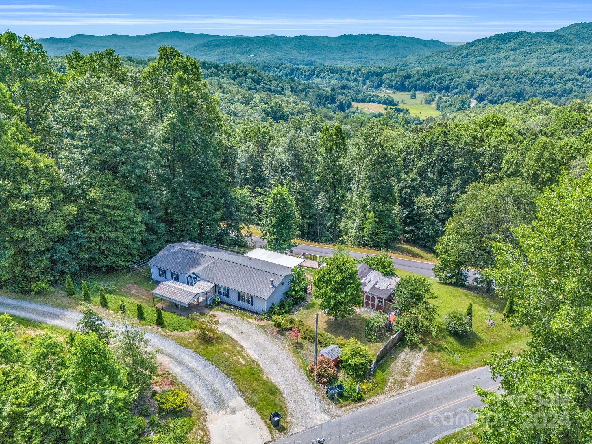 293 Bane Road Mills River, NC 28759 - Photo 44 of 48 an aerial view of a house with yard and outdoor seating