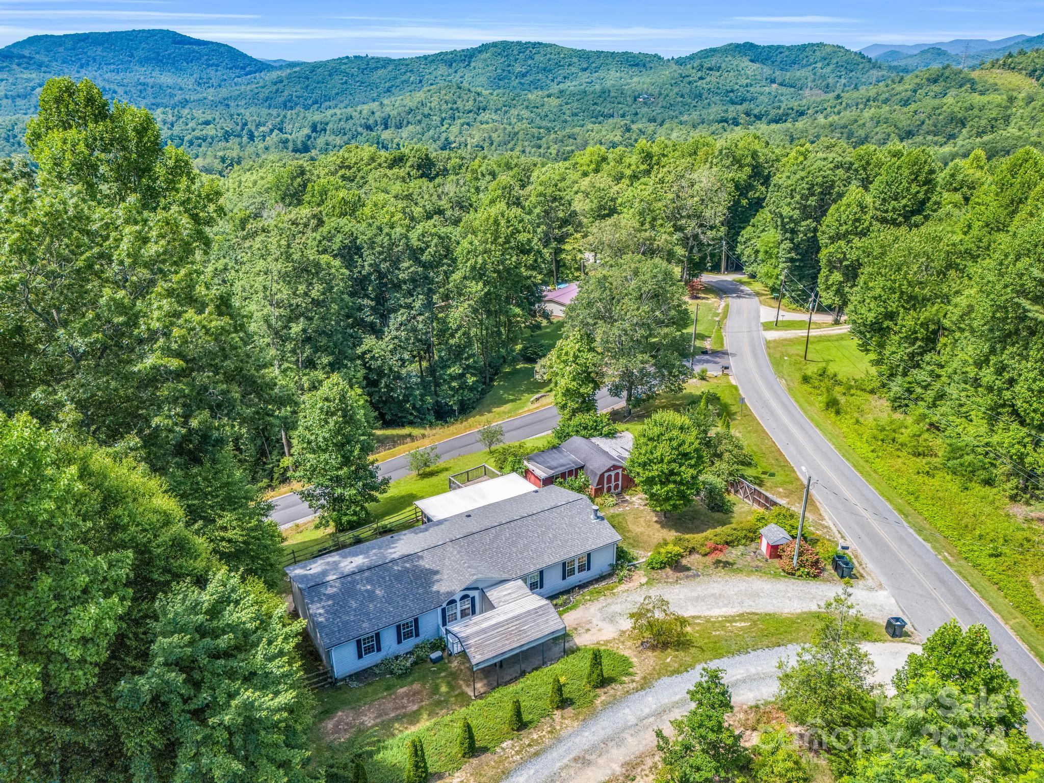 293 Bane Road Mills River, NC 28759 - Photo 45 of 48 an aerial view of a house with a yard