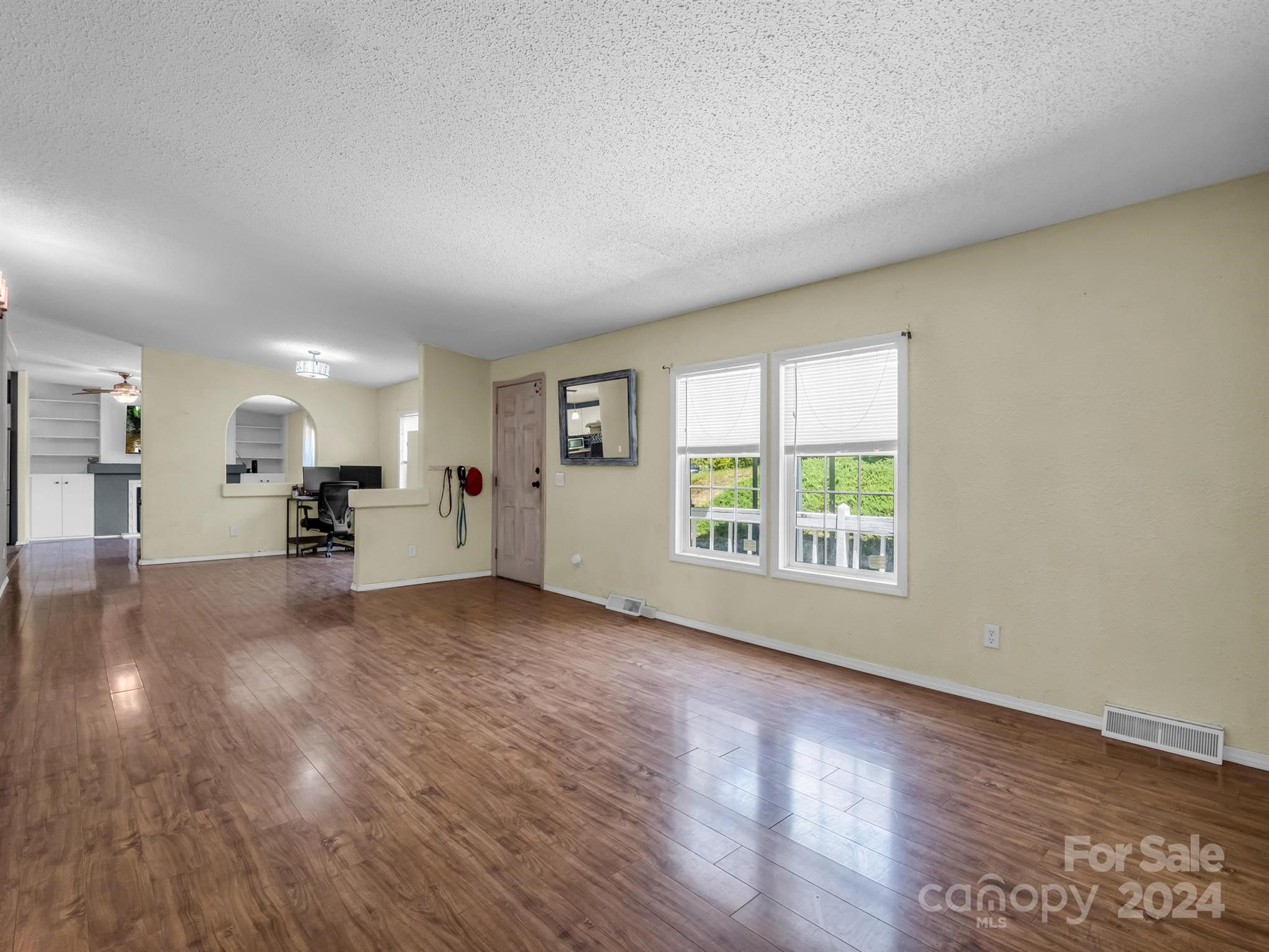 293 Bane Road Mills River, NC 28759 - Photo 6 of 48 a view of a living room a kitchen and a wooden floor