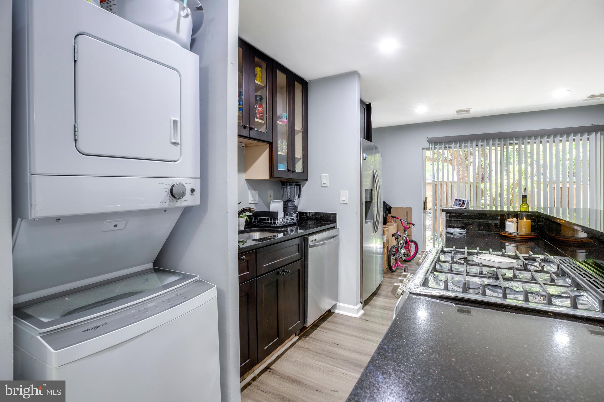 3382 Hewitt Avenue, Unit 102 Silver Spring, MD 20906 - Photo 4 of 22 a kitchen with a stove and a refrigerator