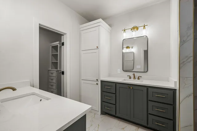 a bathroom with a double vanity sink double vanity and a mirror