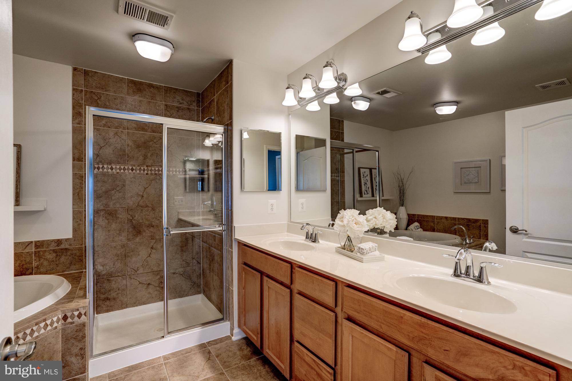 11706 Leesborough Circle, Unit 11706 Silver Spring, MD 20902 - Photo 31 of 39 En-suite bathroom with double vanity