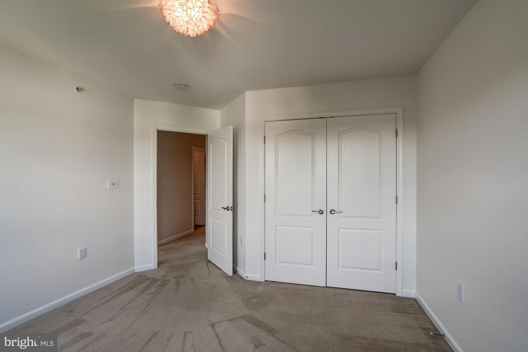 11706 Leesborough Circle, Unit 11706 Silver Spring, MD 20902 - Photo 35 of 39 Bedroom three with large double door closet