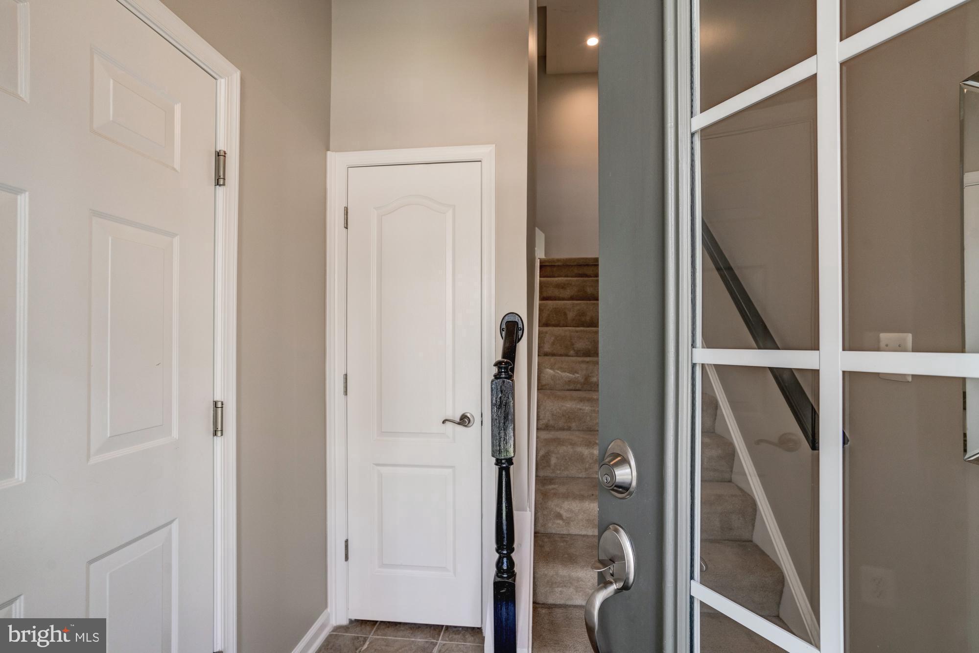 11706 Leesborough Circle, Unit 11706 Silver Spring, MD 20902 - Photo 4 of 39 Large foyer with coat closet and storage area