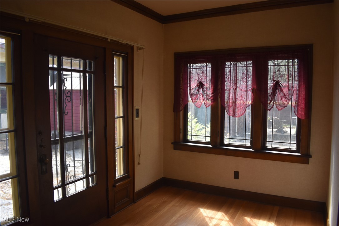 4581 Pearl Road Cleveland, OH 44109 - Photo 2 of 36 Foyer featuring plenty of natural light, wood finished floors, and ornamental molding