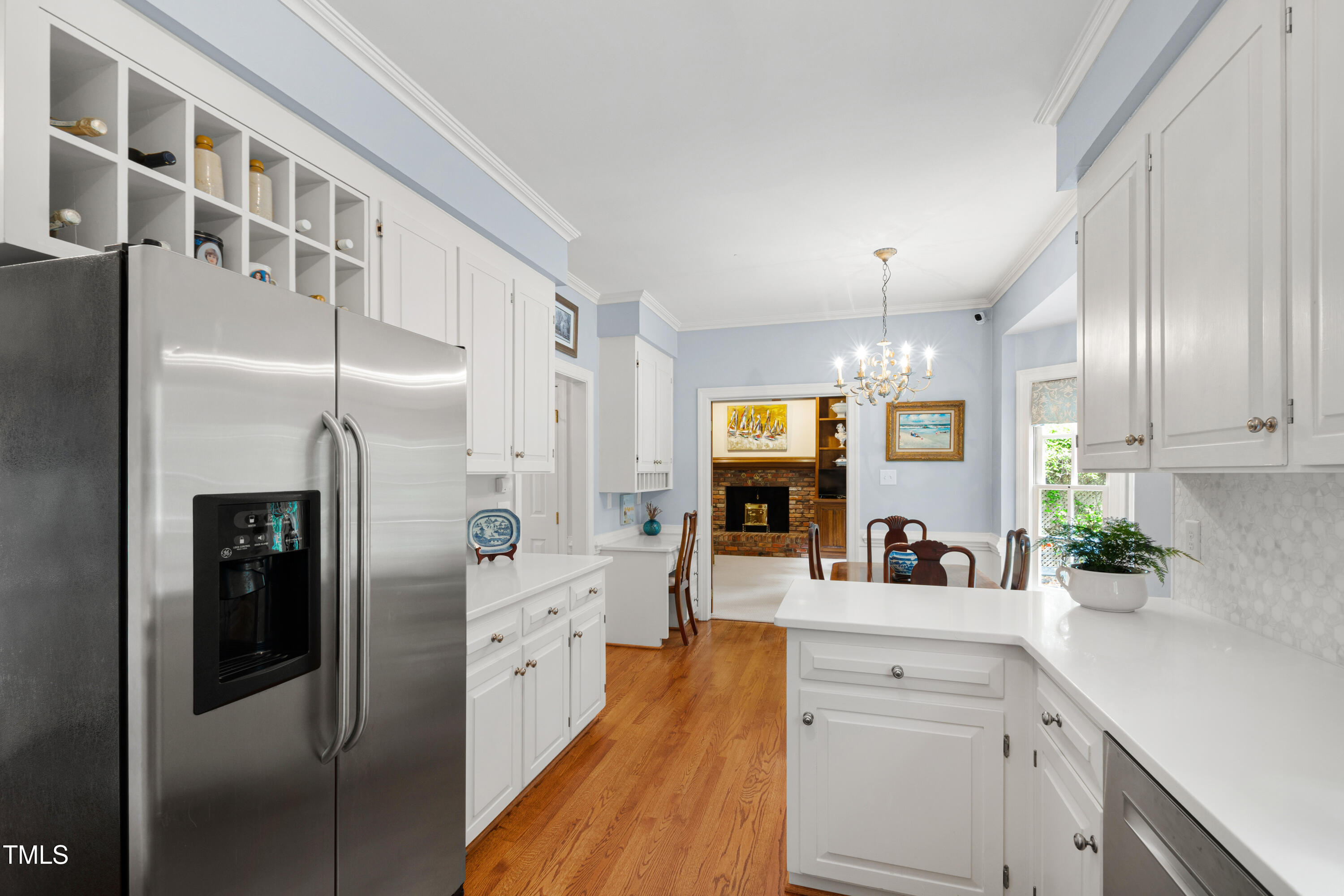 1904 Victoria Road Raleigh, NC 27608 - Photo 13 of 63 a kitchen with stainless steel appliances a refrigerator sink and cabinets
