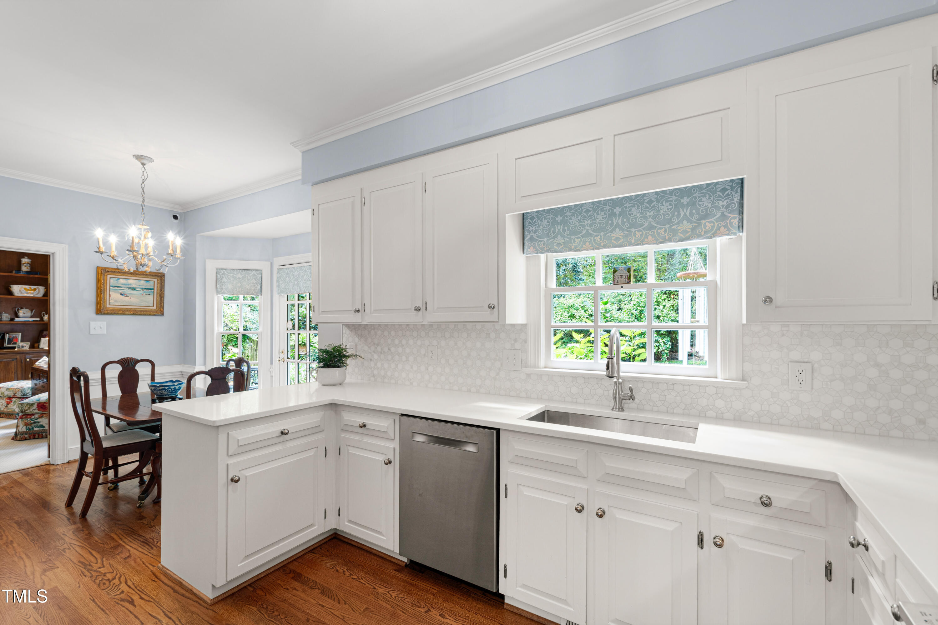 1904 Victoria Road Raleigh, NC 27608 - Photo 14 of 63 a kitchen with a sink cabinets and window