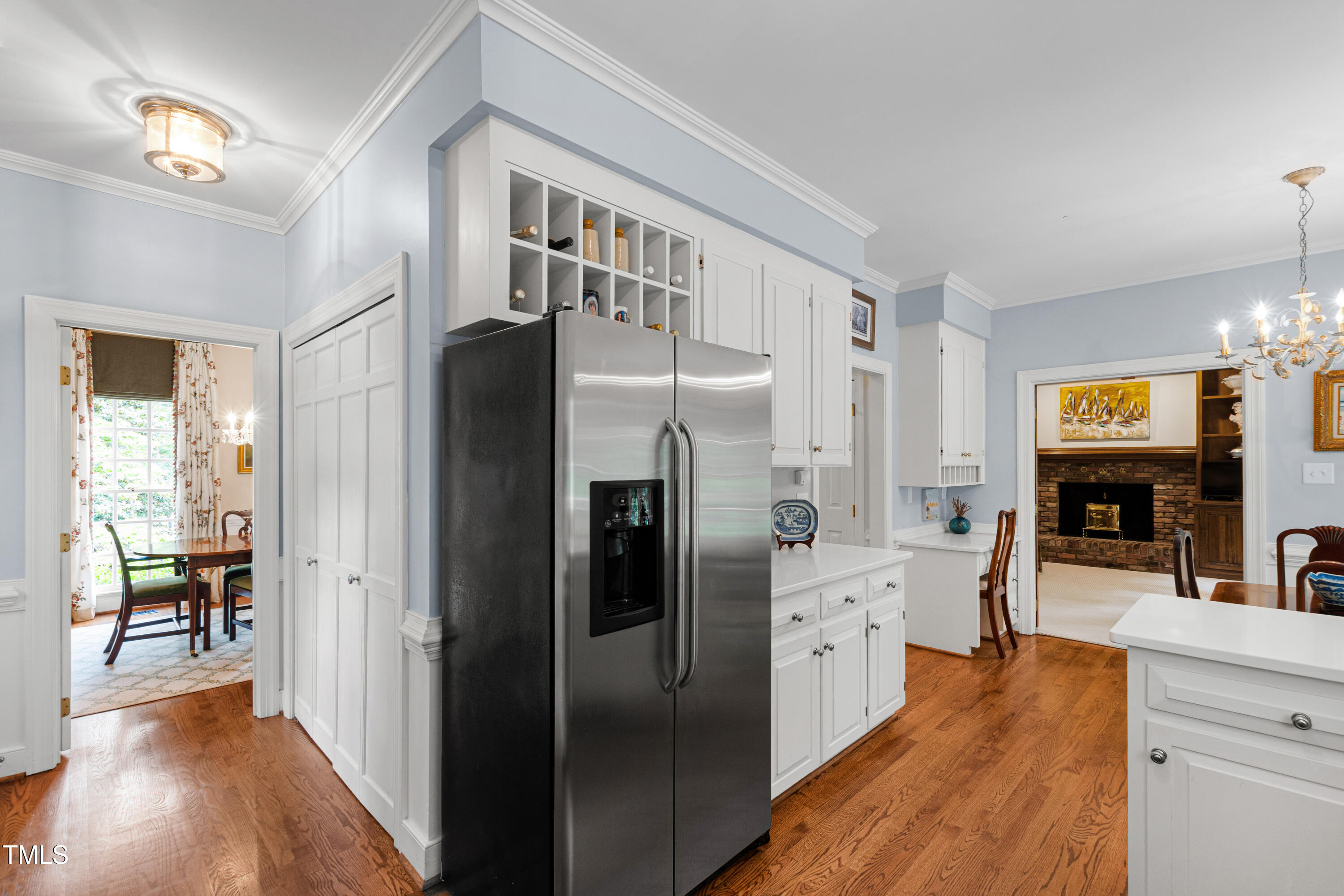 1904 Victoria Road Raleigh, NC 27608 - Photo 15 of 63 a kitchen with stainless steel appliances a refrigerator and a view of living room