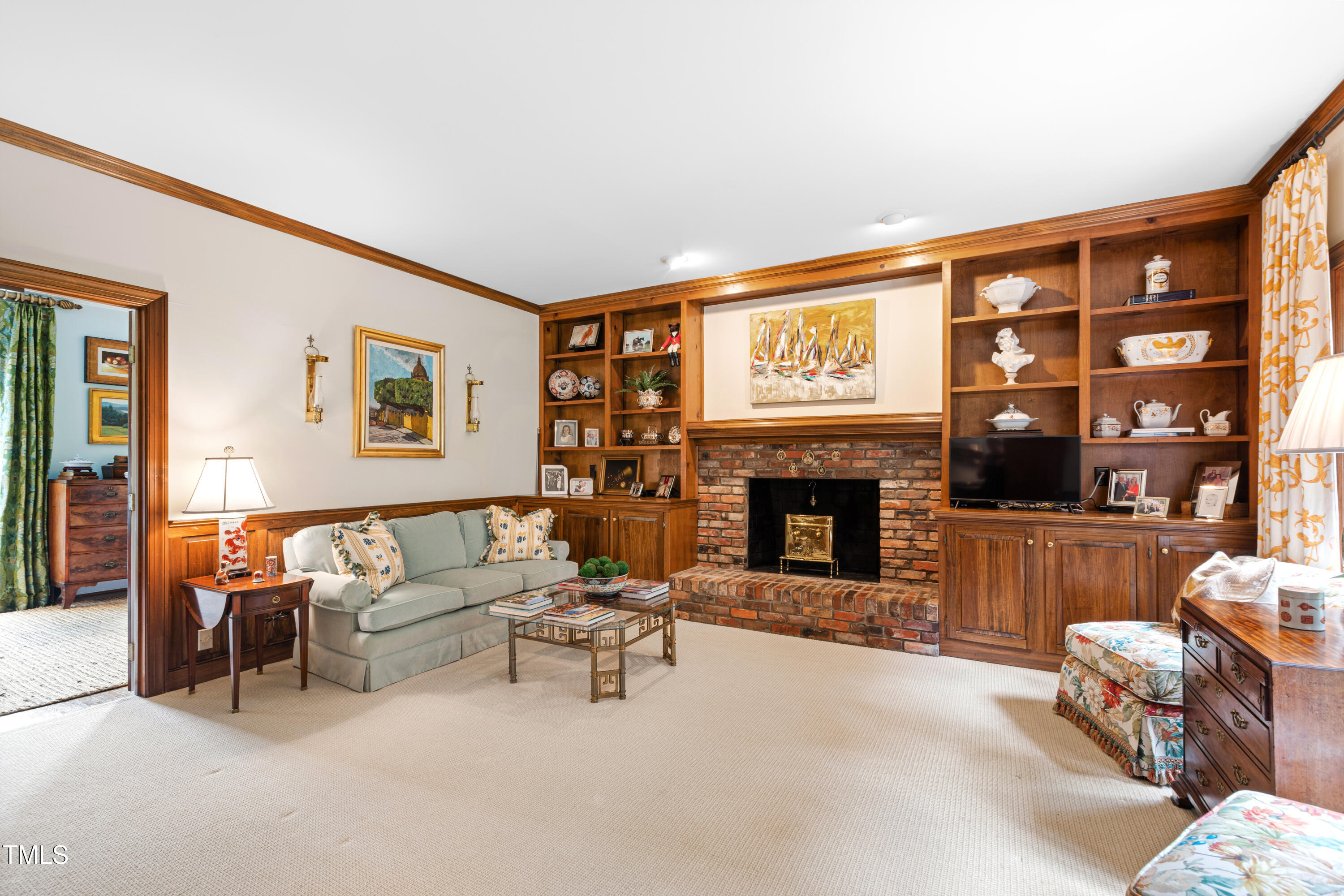 1904 Victoria Road Raleigh, NC 27608 - Photo 20 of 63 a living room with furniture and a fireplace