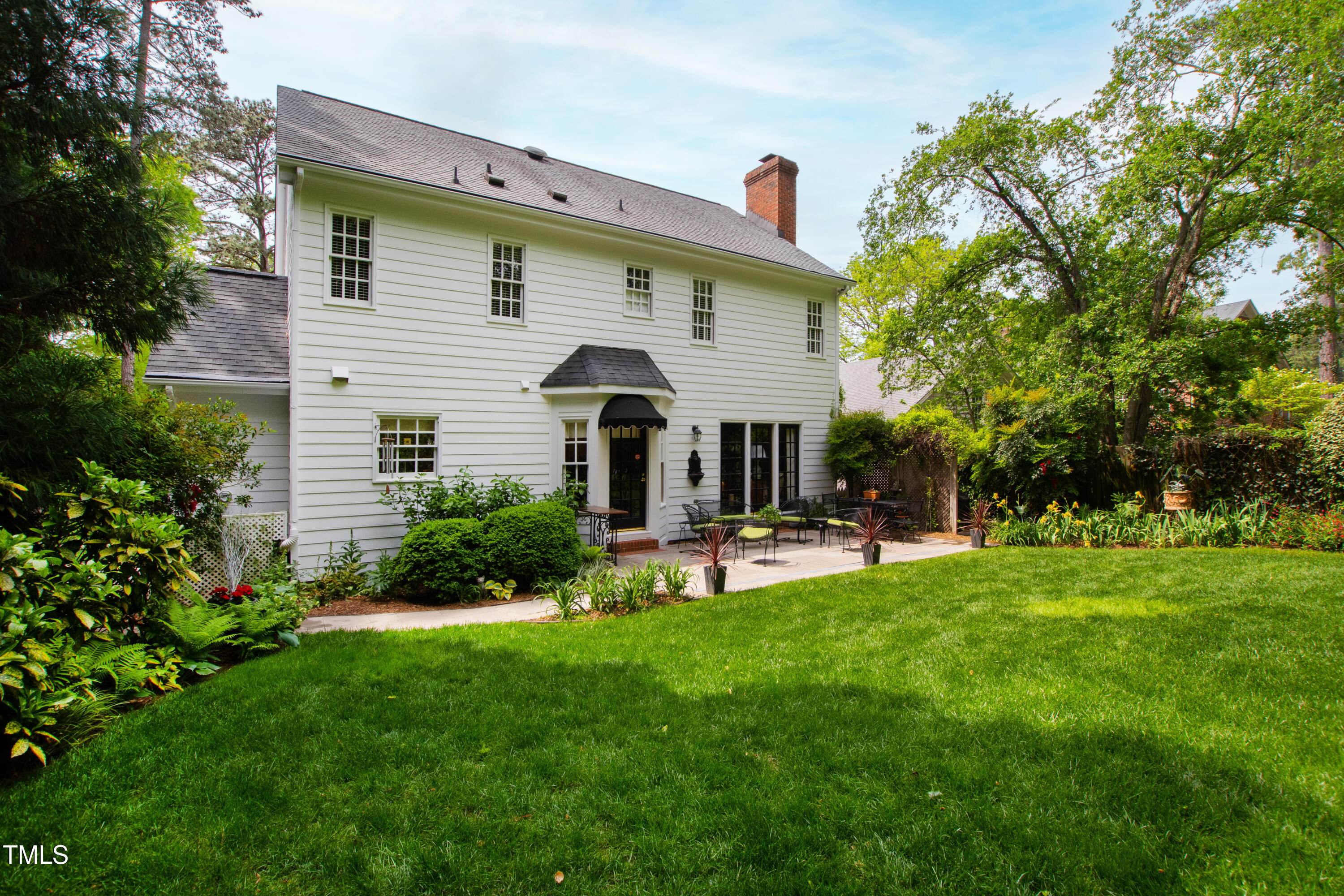 1904 Victoria Road Raleigh, NC 27608 - Photo 29 of 63 a front view of a house with patio and garden