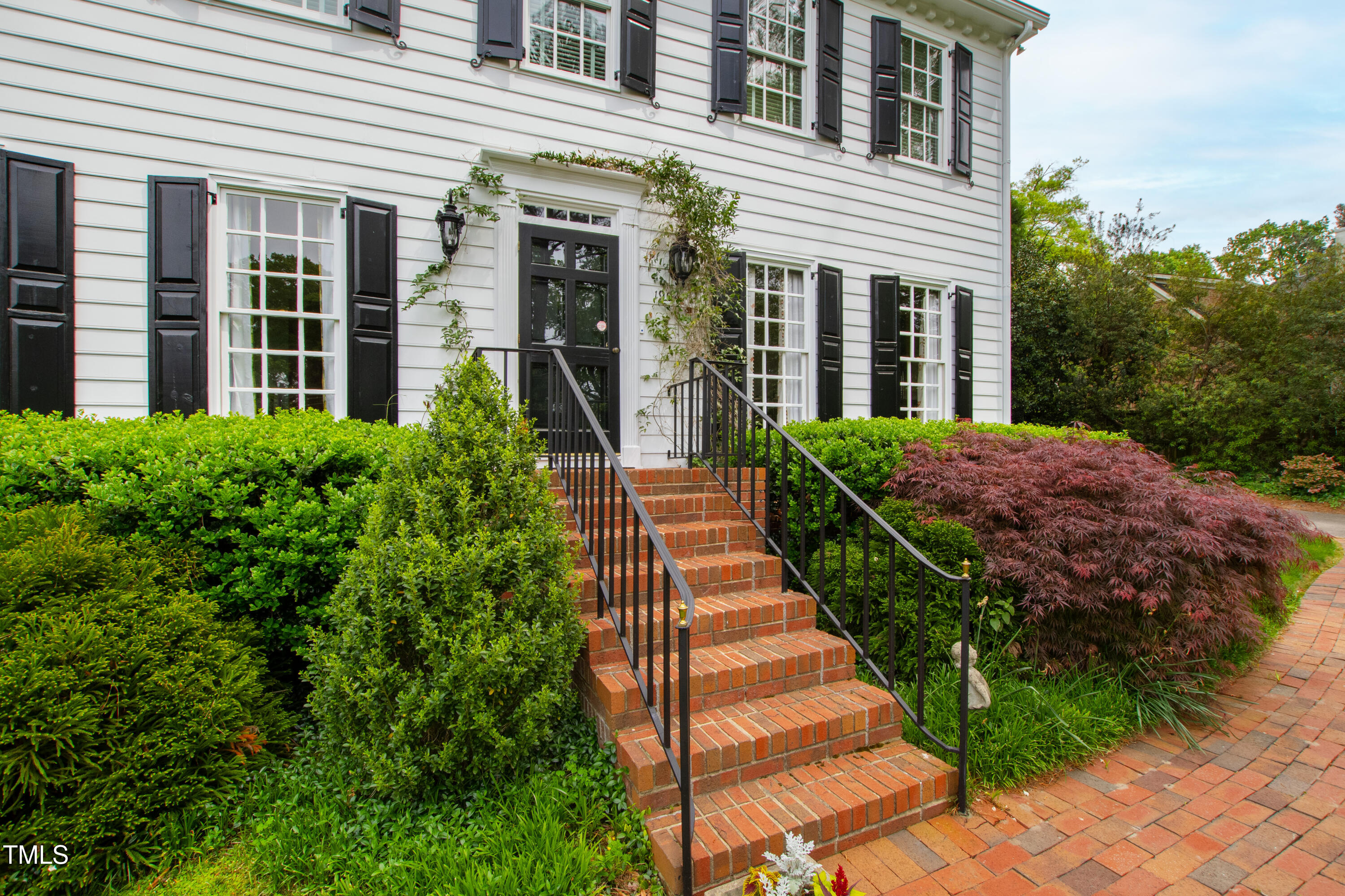1904 Victoria Road Raleigh, NC 27608 - Photo 3 of 63 a view of a house with potted plants