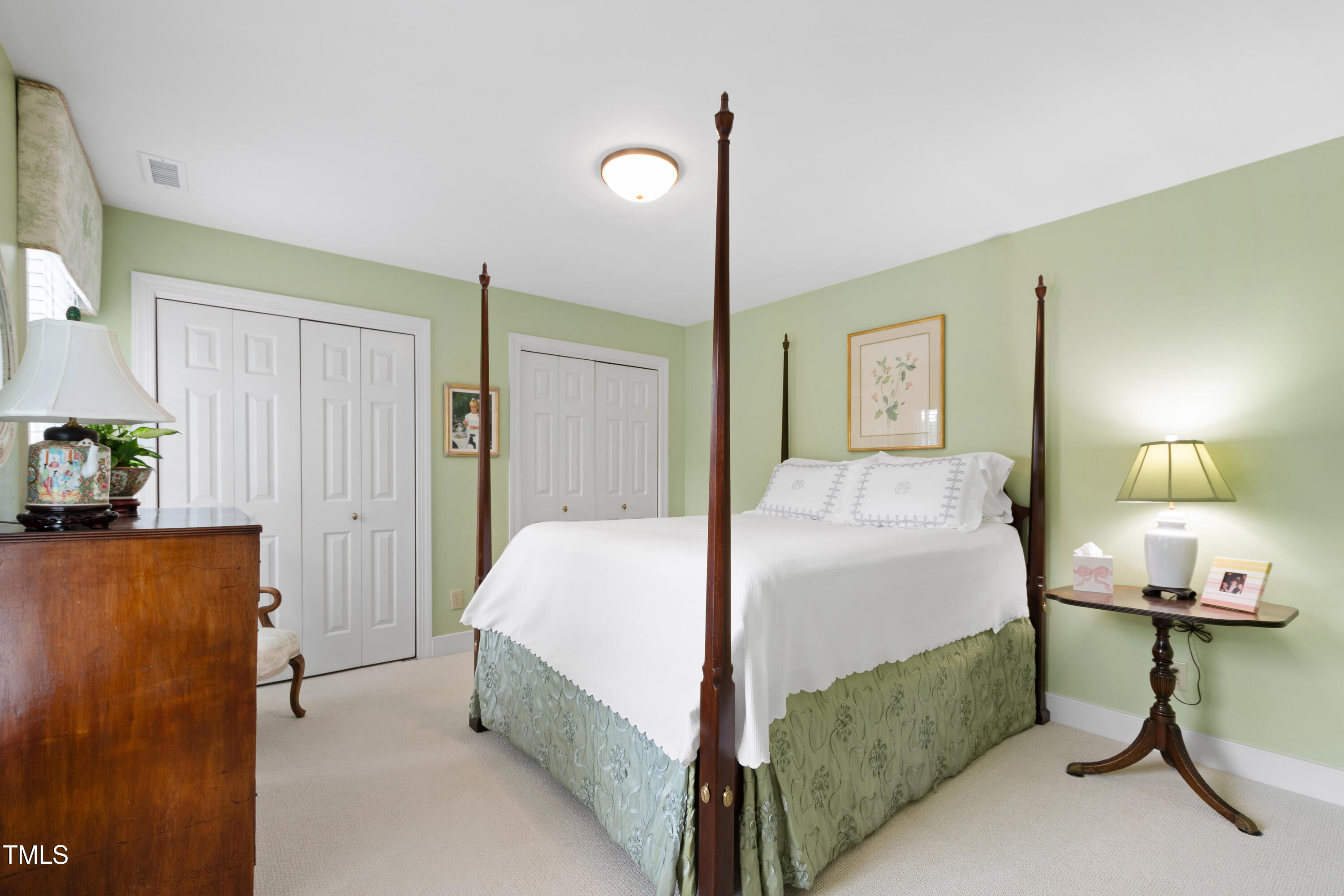 1904 Victoria Road Raleigh, NC 27608 - Photo 40 of 63 a bedroom with a bed and a table in it