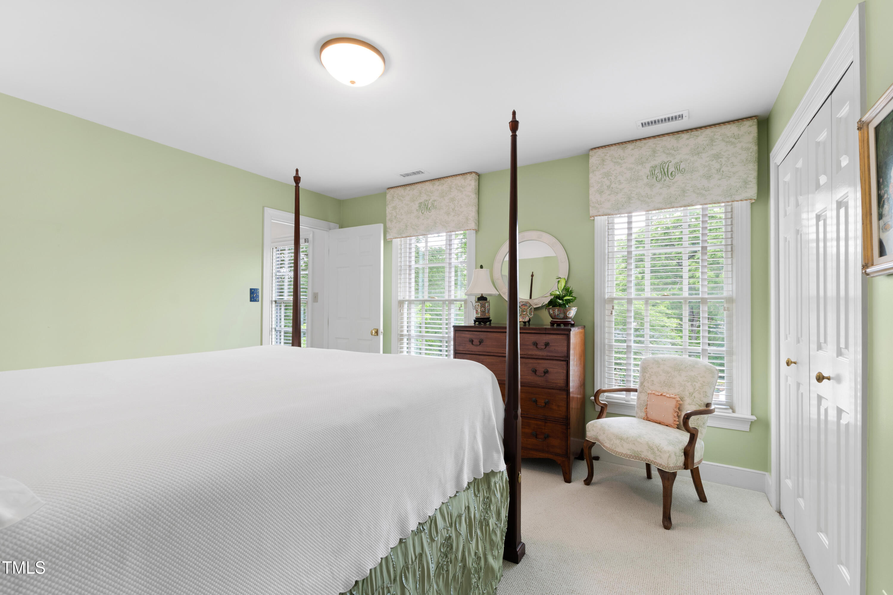 1904 Victoria Road Raleigh, NC 27608 - Photo 41 of 63 a bedroom with a bed and large window