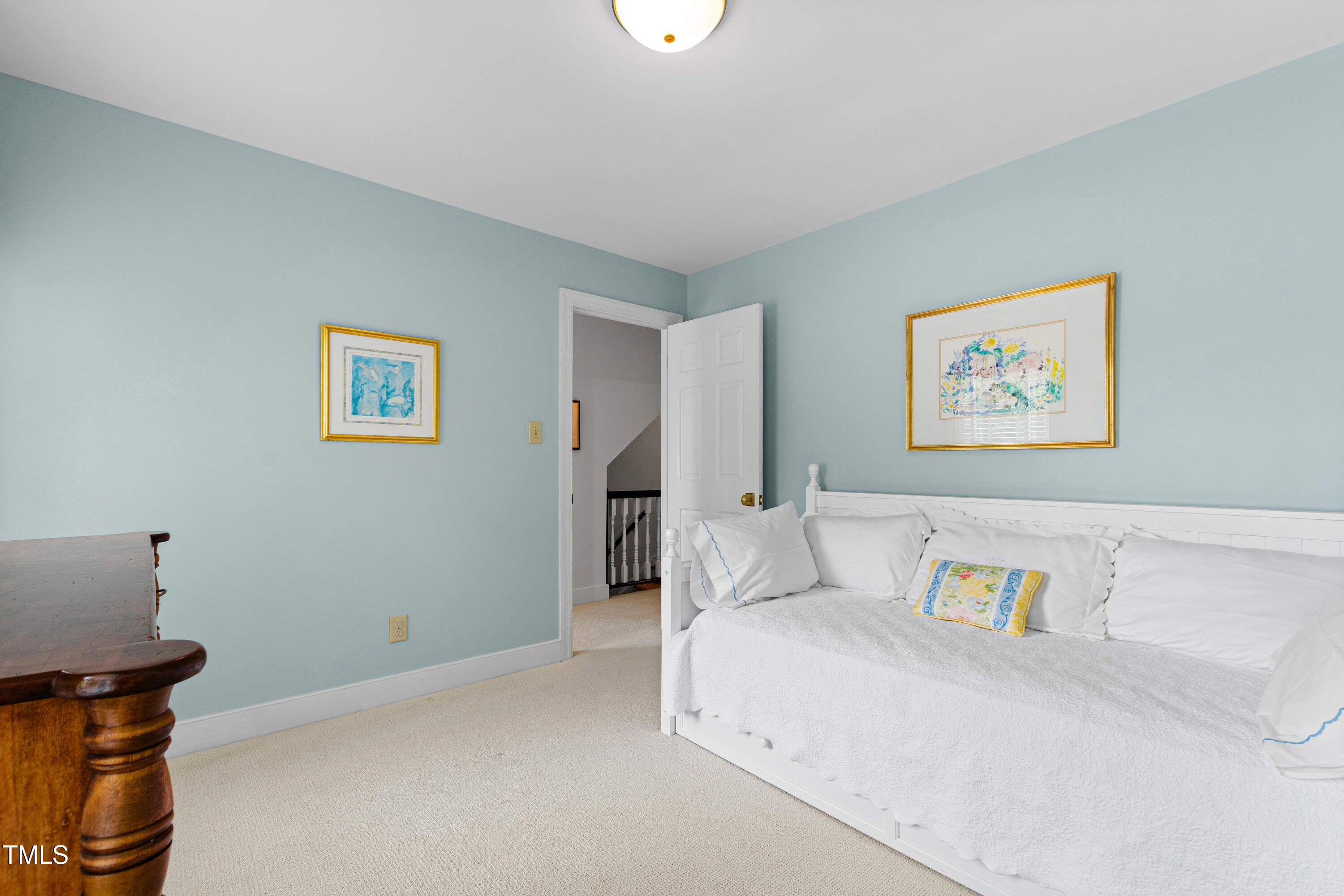 1904 Victoria Road Raleigh, NC 27608 - Photo 46 of 63 a spacious bedroom with a bed and a cabinets