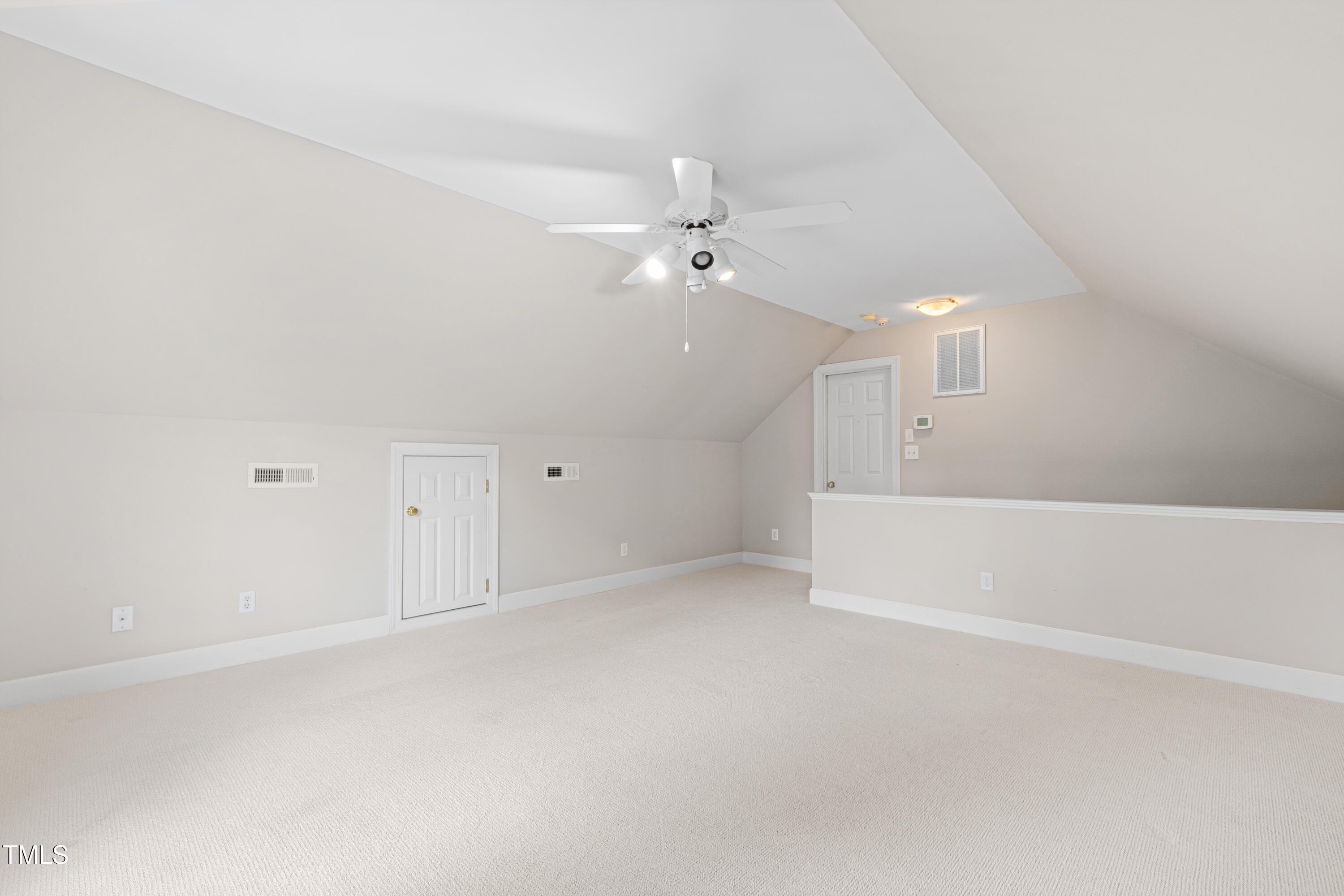 1904 Victoria Road Raleigh, NC 27608 - Photo 50 of 63 an empty room with a ceiling fan and a window