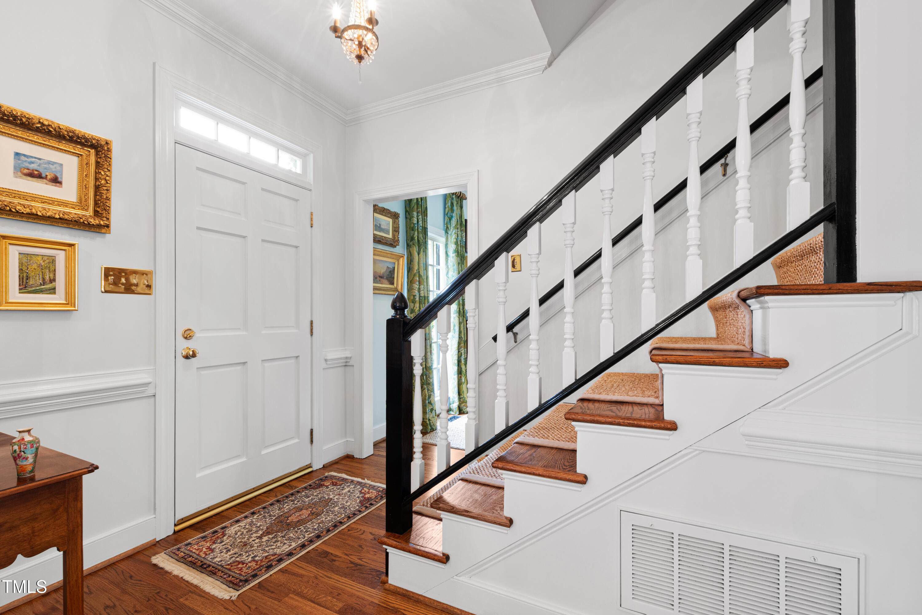 1904 Victoria Road Raleigh, NC 27608 - Photo 5 of 63 a view of entryway with wooden floor and stairs