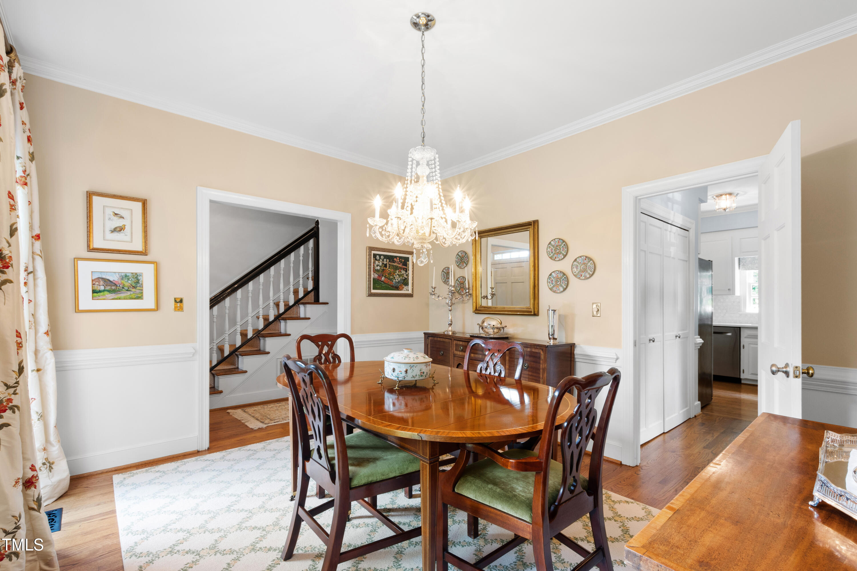 1904 Victoria Road Raleigh, NC 27608 - Photo 8 of 63 a view of a dining room with furniture and a chandelier