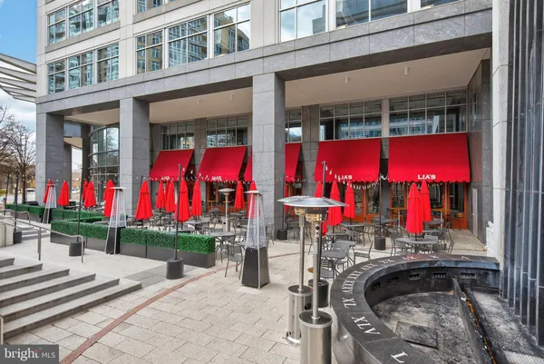 a view of building with red and white umbrella
