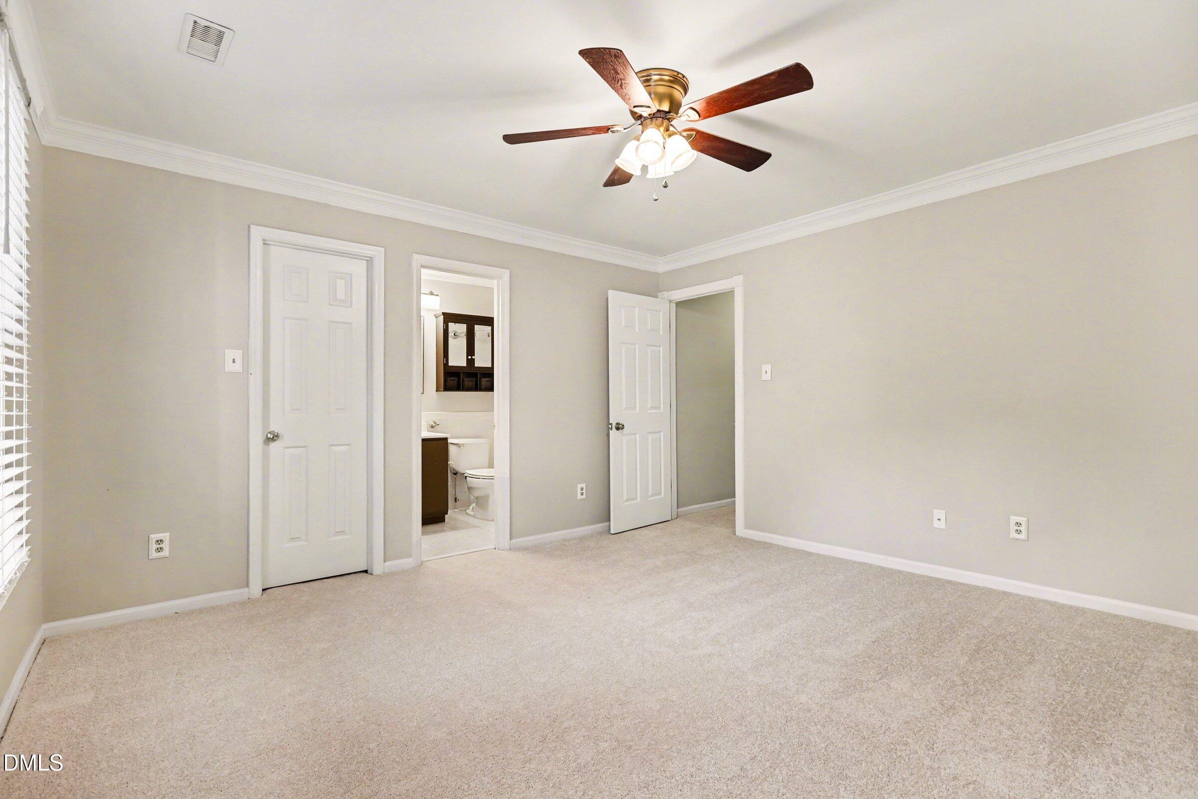 5645 Hamstead Crossing Raleigh, NC 27612 - Photo 18 of 35 an empty room with closet and fan