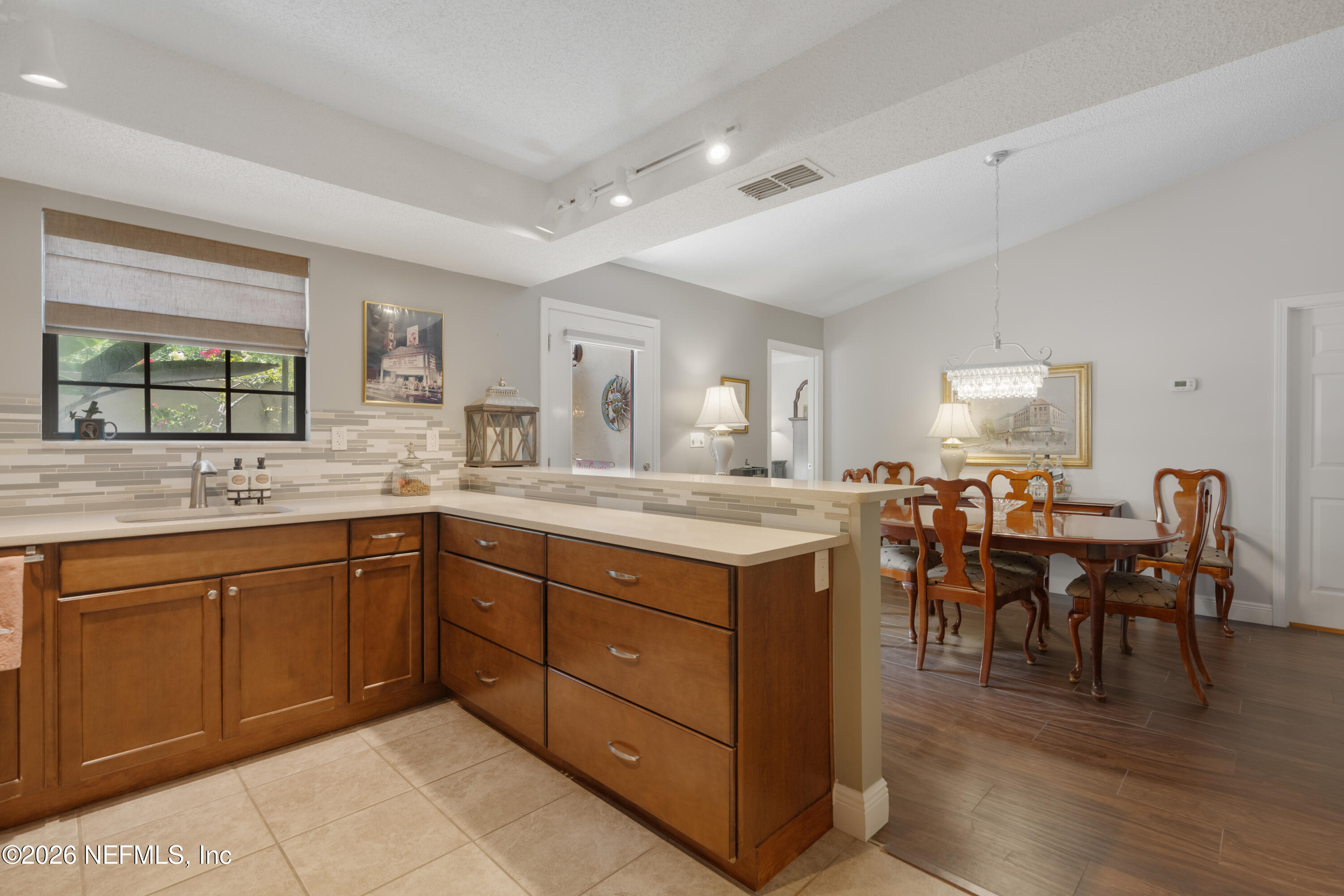 204 Gerado Street, Unit 3 St. Augustine, FL 32080 - Photo 12 of 31 a spacious bathroom with a granite countertop sink and a large mirror