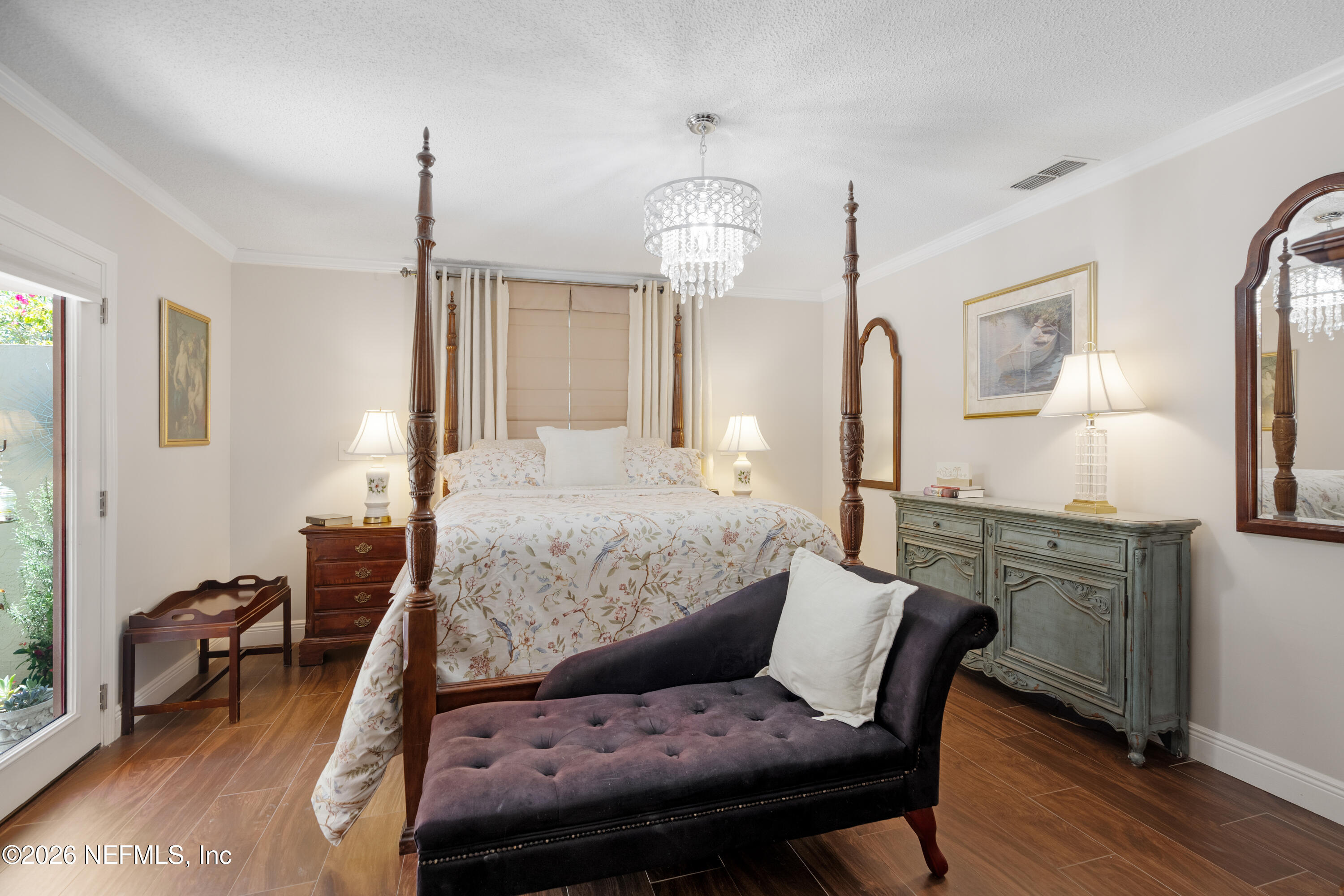 204 Gerado Street, Unit 3 St. Augustine, FL 32080 - Photo 15 of 31 a bedroom with a bed and wooden floor